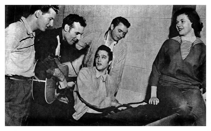 The 'Million Dollar Quartet'. Jerry Lee Lewis, Carl Perkins, Johnny Cash, Elvis Presley, (With Elvis' date, Marilyn Evans). December 4, 1956.