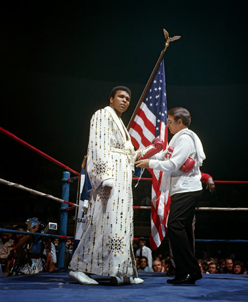 Muhammad Ali wearing the robe and Elvis Presley had given him. vs Ken Norton March 31, 1973.
